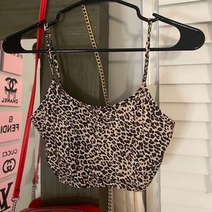 Selling all 3 of these cheetah tops together. All a size small.